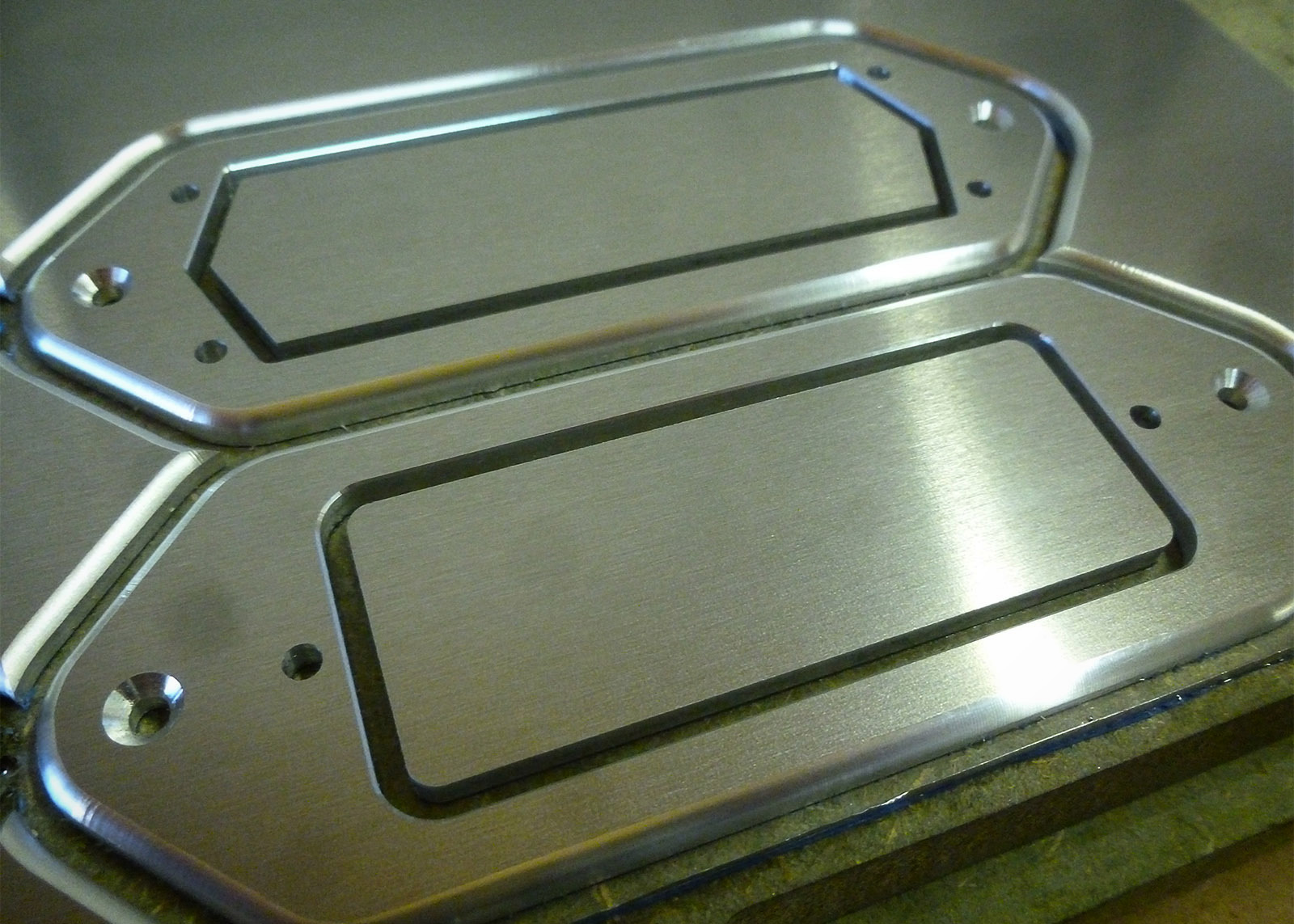 A couple of aluminium pick-up surrounds (Charlie Christian and a mini-humbucker).